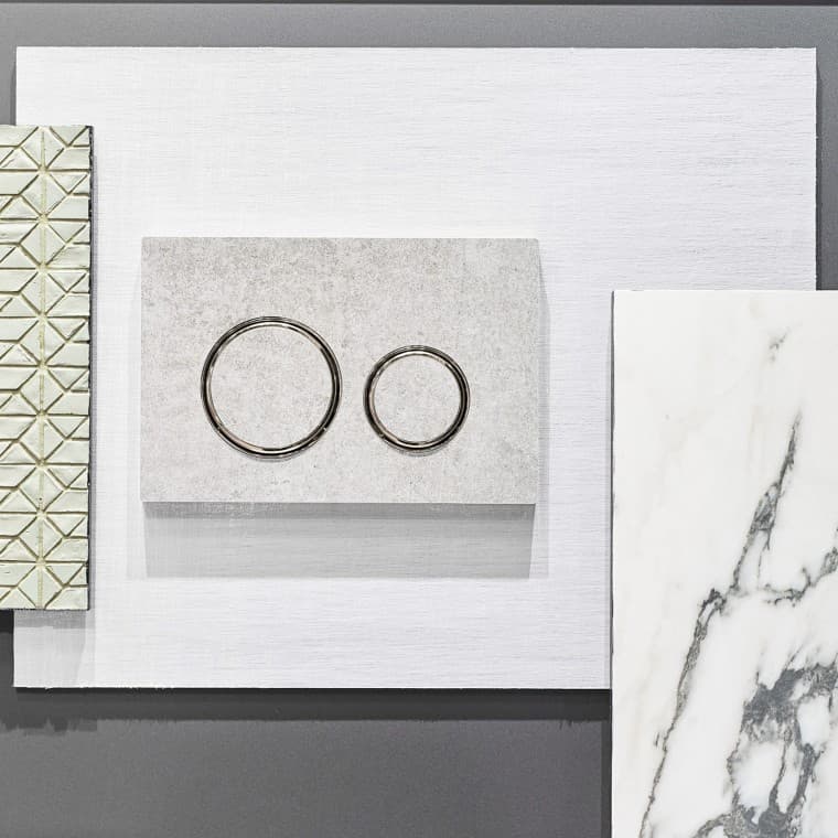 Die Geberit Sigma21 Betätigungsplatte in Betonoptik und verchromten Designringen Die Geberit Sigma21 Betätigungsplatte in Betonoptik und verchromten Designringen